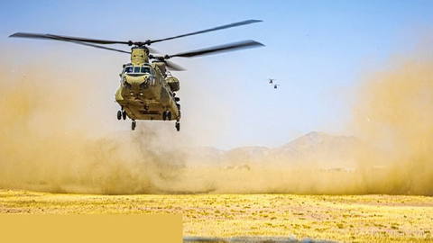 〰〰 A U.S. Army CH-47 Chinook helicopter is preparing to land in the Middle East. The Chinook is a twin-rotor aircraft…