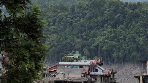 Nepal officials initially blamed an earthquake for a deadly flood at the border of the country with Tibet, but studies suggest landslide and ice likely blocked the river—