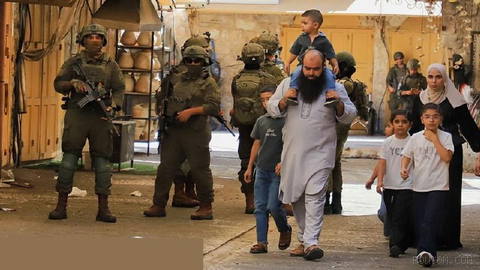 Israeli military checkpoints and barriers restrict Palestinian movement