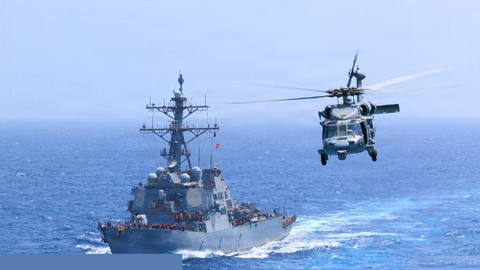 An American warship supports a naval blockade against Iran in the Arabian Sea