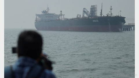 IRGC says a giant oil tanker caught fire and became fully immobilized after hitting two sea mines