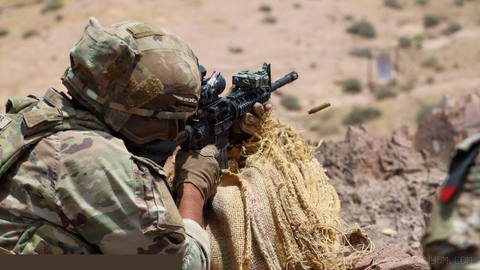 A U.S. Army paratrooper conducts live-fire training with light weapons during deployment in the Middle East.