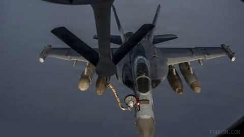 A U.S. Navy EA-18G Growler electronic warfare aircraft, while patrolling over the Middle East, receives an in-air refueling from a U.S. Air Force KC-135 Stratotanker...