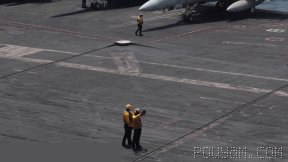 Flight operation by U.S. sailors over the aircraft carrier USS George H.W. Bush